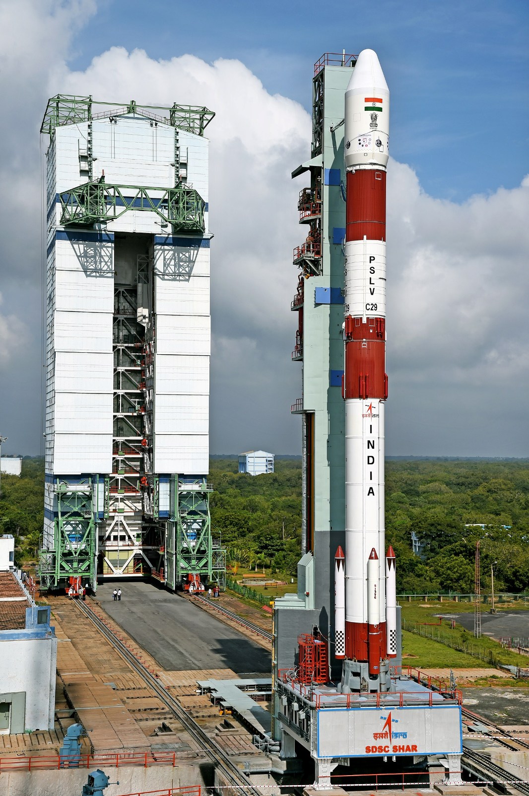 pslv-c29_on_the_first_launch_pad_with_vehicle_assembly_building_in_background
